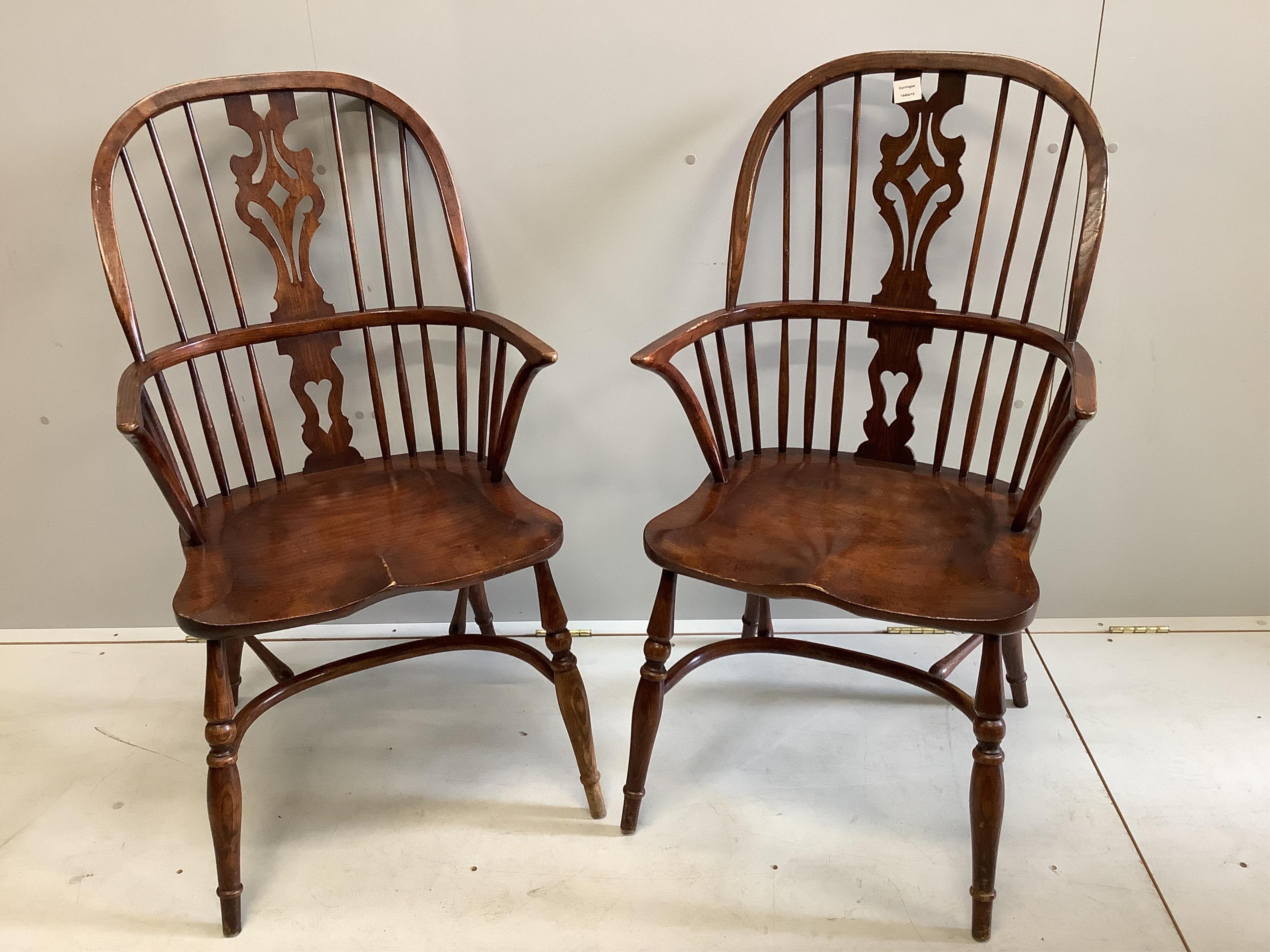 A pair of reproduction Windsor elm and beech armchairs, width 59cm, depth 46cm, height 107cm. Condition - fair